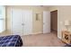 Bedroom with two beds, neutral carpet, and adjacent door and closet doors visible at 81 Branch Creek Trl, Summerville, SC 29483