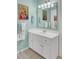 Bathroom featuring a vanity with storage and decorative fixtures at 8656 Laurel Grove Ln, North Charleston, SC 29420