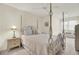Bedroom featuring four-poster bed with patterned bedding and a ceiling fan at 8656 Laurel Grove Ln, North Charleston, SC 29420