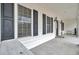 Inviting front porch with a seating area and view of the front yard at 8656 Laurel Grove Ln, North Charleston, SC 29420