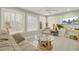 Bright sunroom with multiple windows, tile floors, and a ceiling fan at 8656 Laurel Grove Ln, North Charleston, SC 29420
