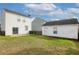 The grassy backyard offers room to relax next to a detached garage at 8957 N Red Maple Cir, Summerville, SC 29485