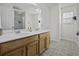 The bathroom has a double sink vanity with updated fixtures and bright lighting at 8957 N Red Maple Cir, Summerville, SC 29485