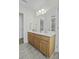 Spacious bathroom featuring double sinks in a vanity, large mirror, and shower at 8957 N Red Maple Cir, Summerville, SC 29485