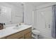 Well-lit bathroom with a toilet, vanity with sink, and a tub/shower combo at 8957 N Red Maple Cir, Summerville, SC 29485
