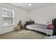 Bright bedroom featuring a bed, window, and a variety of toys creating a fun space at 8957 N Red Maple Cir, Summerville, SC 29485