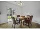 Dining room with sliding door access to the backyard, with seating for four at 8957 N Red Maple Cir, Summerville, SC 29485