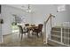 Cozy dining room featuring staircase, access to backyard, and a table with seating for four at 8957 N Red Maple Cir, Summerville, SC 29485