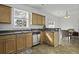 Functional kitchen featuring stainless steel appliances and a convenient breakfast bar leading to the dining area at 8957 N Red Maple Cir, Summerville, SC 29485