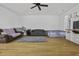 Spacious living room with hardwood floors, ceiling fan, and abundant natural light at 8957 N Red Maple Cir, Summerville, SC 29485