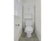 Bathroom toilet features a built-in shelving unit and a neutral color palette at 8957 N Red Maple Cir, Summerville, SC 29485