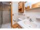 Bathroom with wood cabinets, tile flooring, toilet and shower with glass surround at 904 Randall Dr, Mount Pleasant, SC 29464