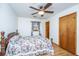 Bedroom with ceiling fan, hardwood floors and windows with floral curtains at 904 Randall Dr, Mount Pleasant, SC 29464
