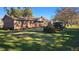 Charming brick home featuring a well-manicured lawn and beautiful landscaping at 904 Randall Dr, Mount Pleasant, SC 29464