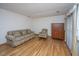 Spacious living room featuring hardwood floors and an upholstered sofa and armchair at 904 Randall Dr, Mount Pleasant, SC 29464