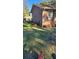 Side yard of a brick home with well-maintained landscaping and green lawn at 904 Randall Dr, Mount Pleasant, SC 29464