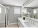 Elegant bathroom featuring a double vanity, bright lighting, modern fixtures, and a glass-enclosed shower at 972 Key Colony Ct, Mount Pleasant, SC 29464