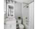 Well-lit bathroom with a white vanity, modern fixtures, and a shower-tub combination with tile surround at 972 Key Colony Ct, Mount Pleasant, SC 29464