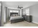 Cozy bedroom featuring a stylish gray bed frame, ceiling fan, and soft natural light from the windows at 972 Key Colony Ct, Mount Pleasant, SC 29464
