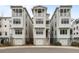 Three-story townhomes featuring private garages, multiple balconies and neutral color scheme at 972 Key Colony Ct, Mount Pleasant, SC 29464