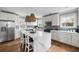 Bright kitchen with white cabinets, stainless steel appliances, and a center island with marble countertop at 972 Key Colony Ct, Mount Pleasant, SC 29464
