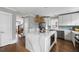 Bright kitchen with white cabinets, stainless steel appliances, and a center island with marble countertop at 972 Key Colony Ct, Mount Pleasant, SC 29464