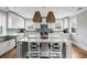 Bright kitchen with white cabinets, stainless steel appliances, and a center island with marble countertop at 972 Key Colony Ct, Mount Pleasant, SC 29464