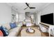 Cozy living room featuring a large round coffee table, comfortable seating, and ample natural light at 972 Key Colony Ct, Mount Pleasant, SC 29464