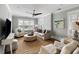 Cozy living room featuring a large round coffee table, comfortable seating, and ample natural light at 972 Key Colony Ct, Mount Pleasant, SC 29464