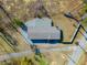 Aerial view of a home with a long driveway, showcasing the roof and surrounding trees on the property at 1026 Cane Gully Rd, Moncks Corner, SC 29461