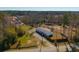 Aerial view of a single-story home on a large lot with a long driveway, fencing, and surrounding trees at 1026 Cane Gully Rd, Moncks Corner, SC 29461