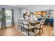 Inviting dining area with stylish furniture adjacent to an open kitchen, perfect for modern living and entertaining at 1026 Cane Gully Rd, Moncks Corner, SC 29461