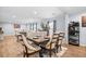 Bright dining room featuring a wooden table, cushioned chairs, and seamless flow to the living space at 1026 Cane Gully Rd, Moncks Corner, SC 29461