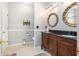 Well-lit bathroom features granite countertop, dual sinks and tile floors at 103 Hazelton Ct, Goose Creek, SC 29445
