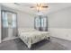 Cozy bedroom with a ceiling fan, carpeted floor and large windows at 103 Hazelton Ct, Goose Creek, SC 29445