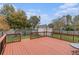 Spacious wood deck perfect for outdoor entertaining with black metal railings and a fenced backyard at 103 Hazelton Ct, Goose Creek, SC 29445