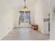 Dining area with neutral walls, laminate flooring, and an elegant chandelier at 103 Hazelton Ct, Goose Creek, SC 29445