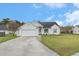 Charming one-story home with a well-manicured lawn and attached two-car garage at 103 Hazelton Ct, Goose Creek, SC 29445