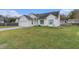 Well-maintained home featuring a large front lawn and welcoming curb appeal at 103 Hazelton Ct, Goose Creek, SC 29445