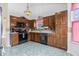 Spacious kitchen with dark wood cabinets and ample counter space at 103 Hazelton Ct, Goose Creek, SC 29445