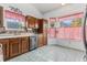 Kitchen with wooden cabinets, stylish backsplash, tile floors and a garden view at 103 Hazelton Ct, Goose Creek, SC 29445