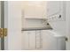 Functional laundry room with cabinets, countertop, and modern washer and dryer at 103 Hazelton Ct, Goose Creek, SC 29445