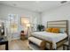 Cozy bedroom features natural light from the windows, a stylish light fixture and a bench at 109 Osprey Ridge Ln, Summerville, SC 29483