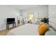 Bedroom with lots of natural light from the windows, stylish decor and wood floors at 109 Osprey Ridge Ln, Summerville, SC 29483