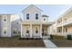 Charming two-story home featuring a welcoming front porch with classic columns and a well-manicured lawn at 109 Osprey Ridge Ln, Summerville, SC 29483