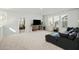 Spacious living room with a large sectional sofa, TV console with storage, and an open doorway to another space at 109 Osprey Ridge Ln, Summerville, SC 29483