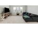 Bright living room with a large sectional sofa, and a TV console with ample storage at 109 Osprey Ridge Ln, Summerville, SC 29483