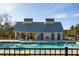 Relaxing community pool with a modern pool house, ample seating, and a dedicated accessible access point at 109 Osprey Ridge Ln, Summerville, SC 29483