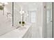 Bright bathroom featuring dual sinks, marble countertops, and elegant fixtures at 11 Church St, Charleston, SC 29401