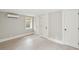 Neutral bedroom with tile flooring, built in mini split AC and ample closet space at 11 Church St, Charleston, SC 29401